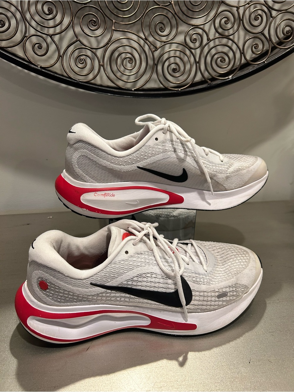 Nike White Athletic Running Shoes with Red Accents and Black Swoosh